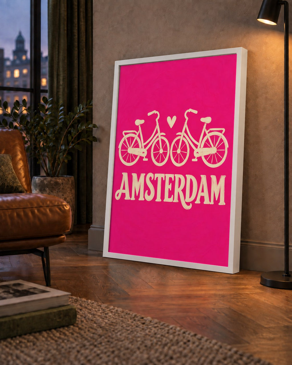 Amsterdam Temalı Bisiklet İllüstrasyonlu Canlı Pembe Poster — çerçeveli hâliyle bir ev duvarında