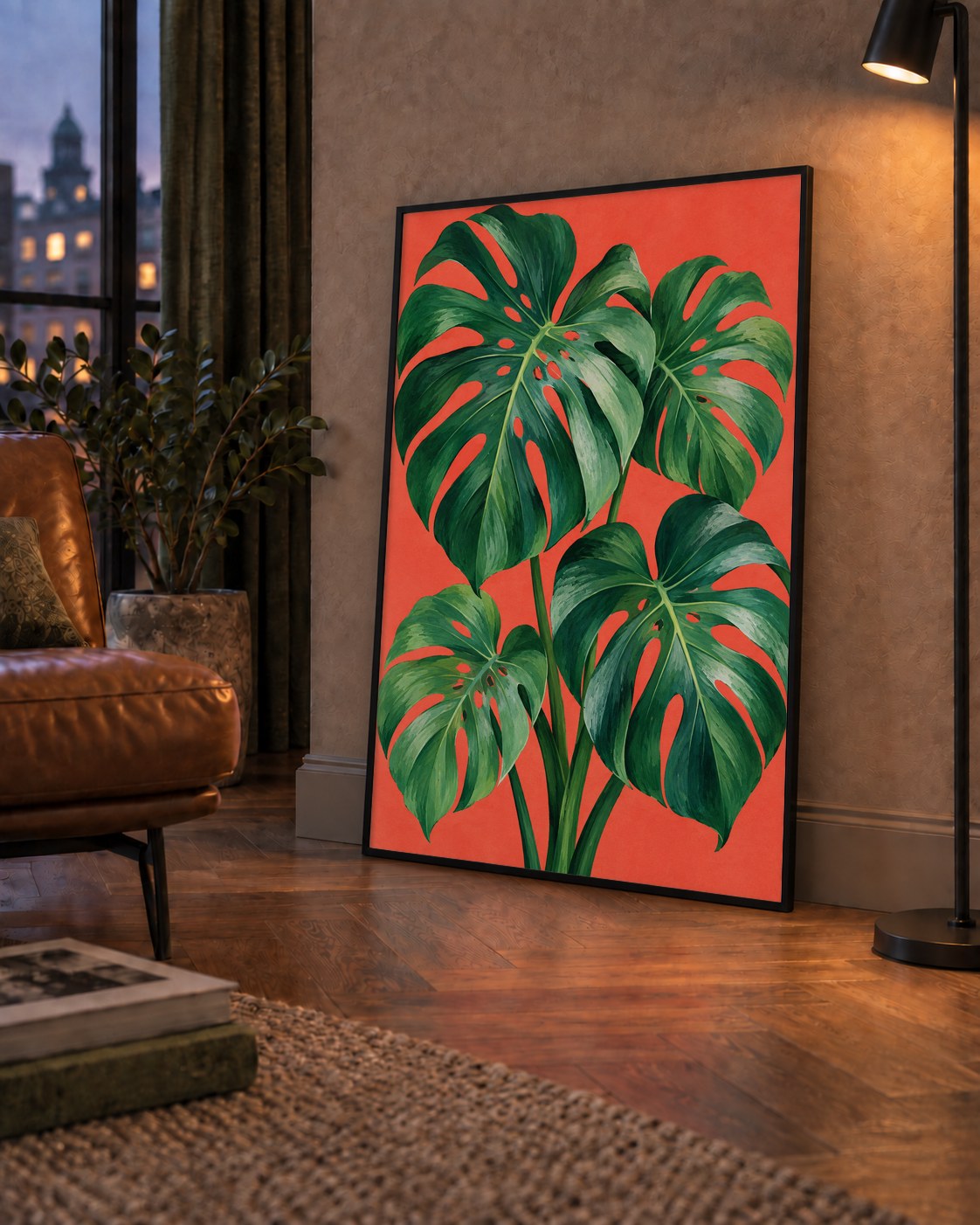 Canlı Turuncu Arka Planlı Monstera Yaprakları Sanat Posteri — çerçeveli hâliyle bir ev duvarında