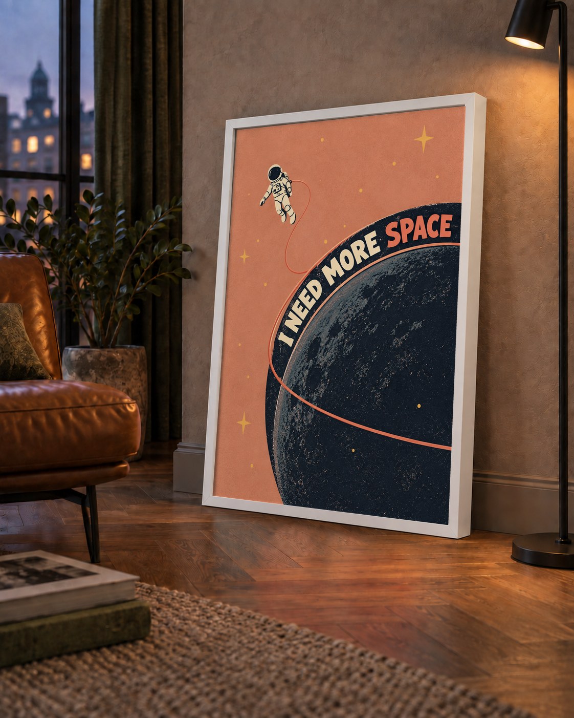Retro Astronot Poster – Mizahi 'I NEED MORE SPACE' Tasarımı — çerçeveli hâliyle bir ev duvarında