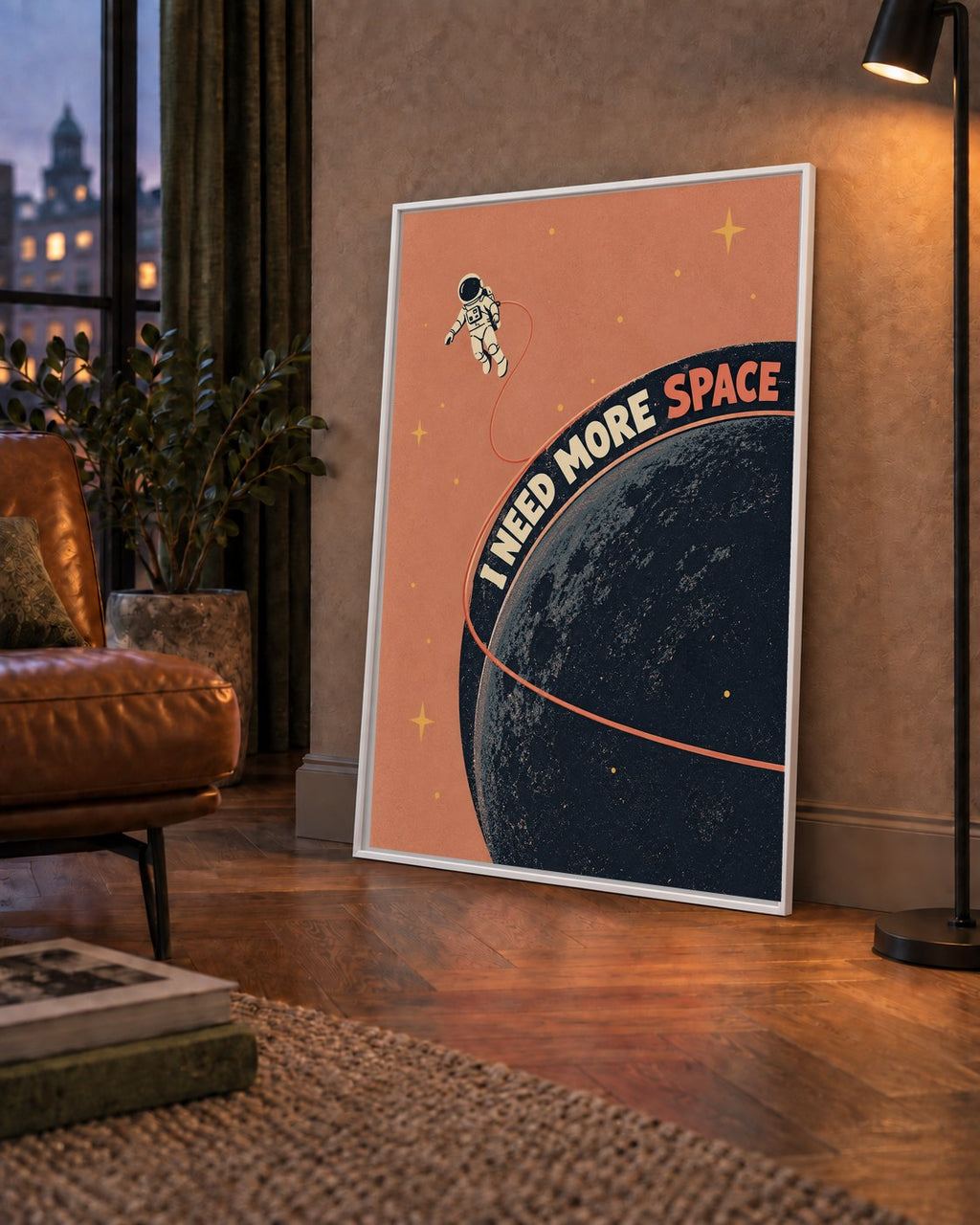 Retro Astronot Poster – Mizahi 'I NEED MORE SPACE' Tasarımı — çerçeveli hâliyle bir ev duvarında