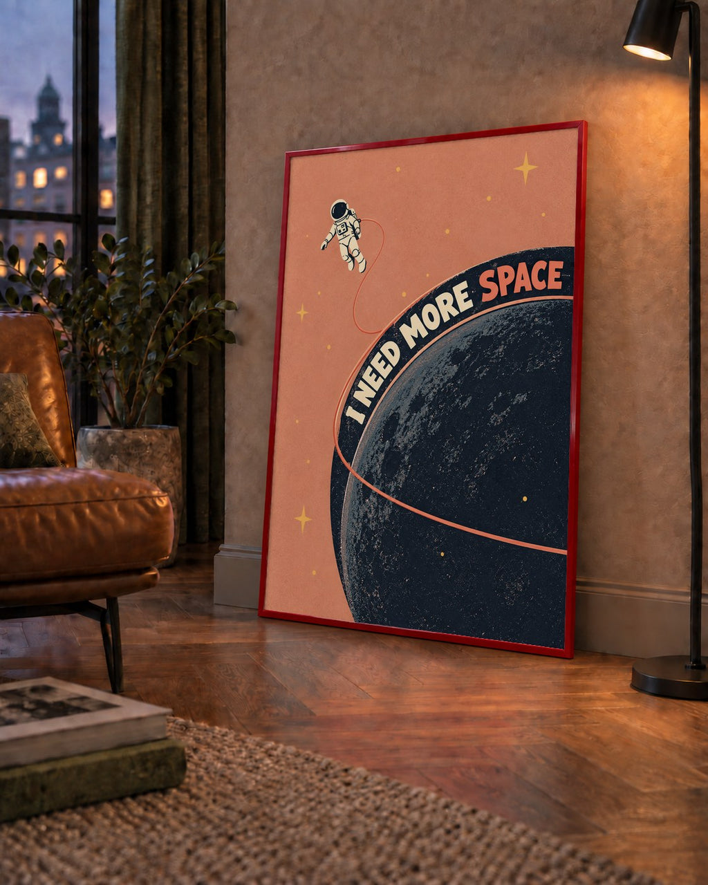 Retro Astronot Poster – Mizahi 'I NEED MORE SPACE' Tasarımı — çerçeveli hâliyle bir ev duvarında