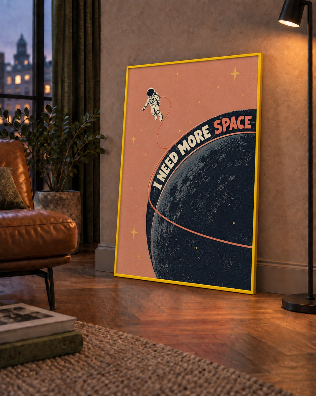 Retro Astronot Poster – Mizahi 'I NEED MORE SPACE' Tasarımı — çerçeveli hâliyle bir ev duvarında