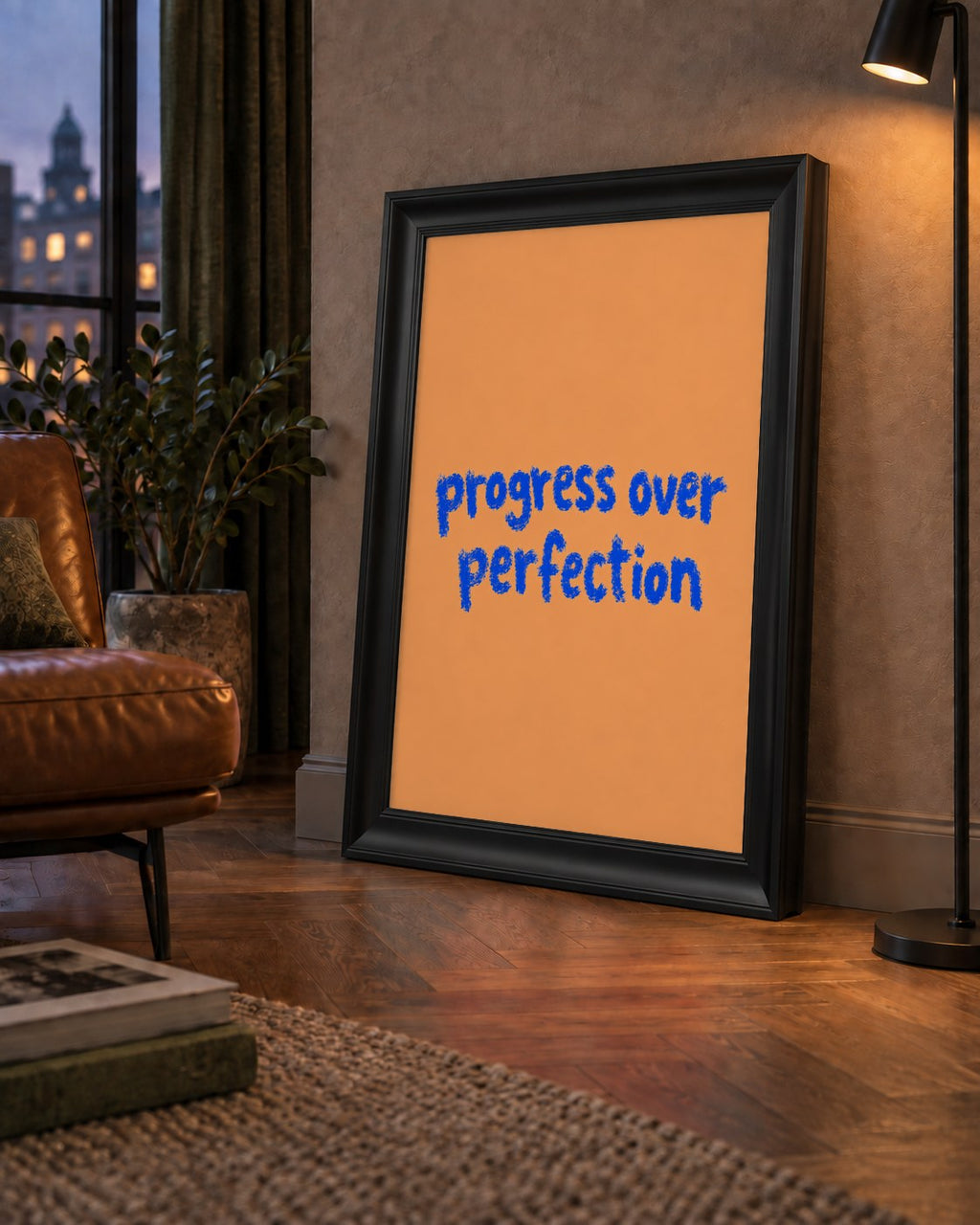 Progress Over Perfection Minimal Turuncu Poster — çerçeveli hâliyle bir ev duvarında